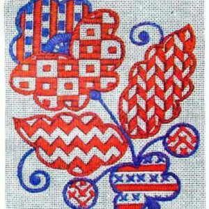 Вишиті червоними і синіми нитками квіти